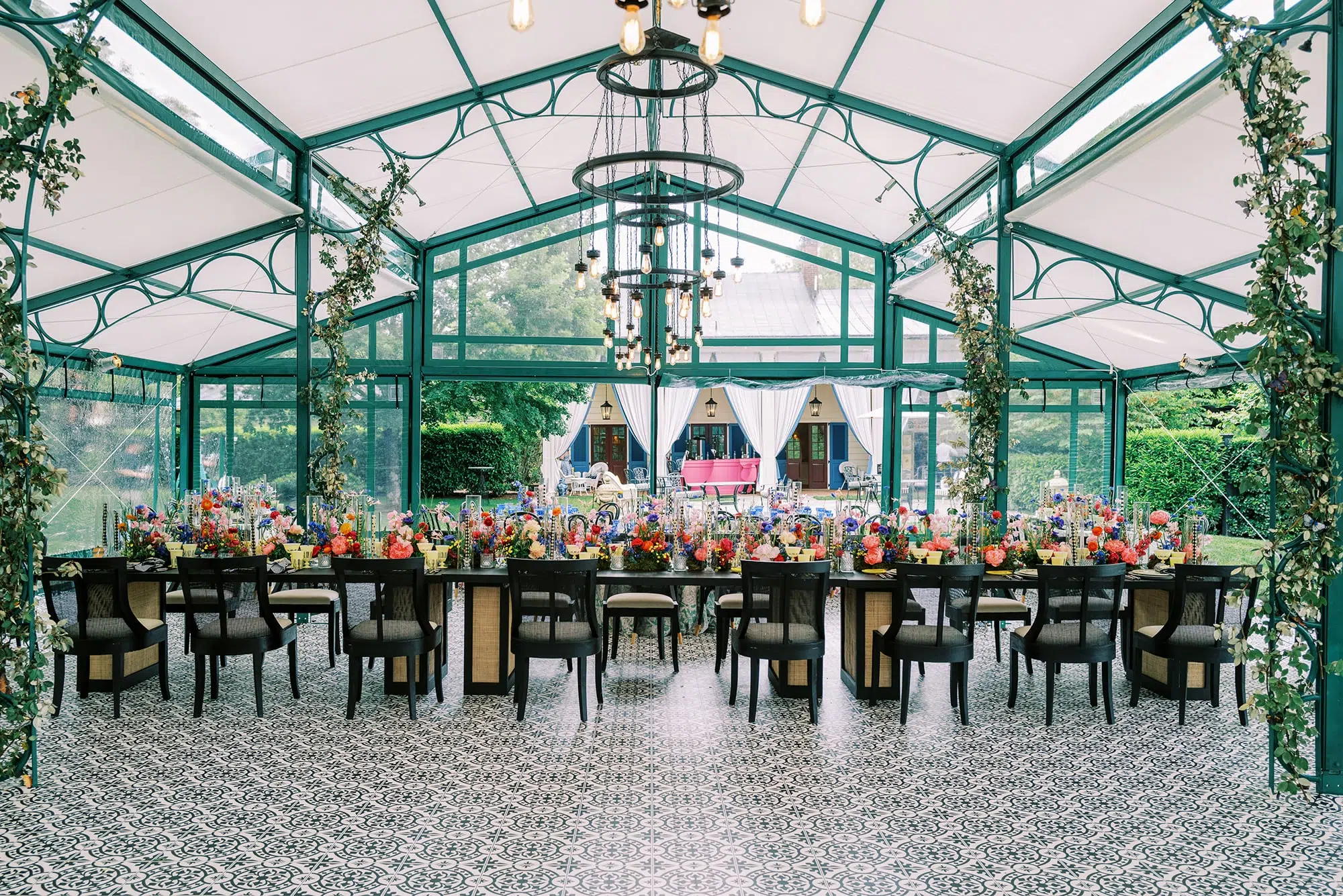Inside luxury outdoor tent with chairs and flowers