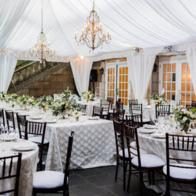 30x40 White structure tent with leg drapes lighting package and 2 Valencia Chandeliers 1 Edit 500x500